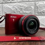 Nikon 1 J1 Crimson with accessories 