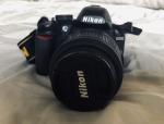 Nikon D3100 with two lenses and battery charger